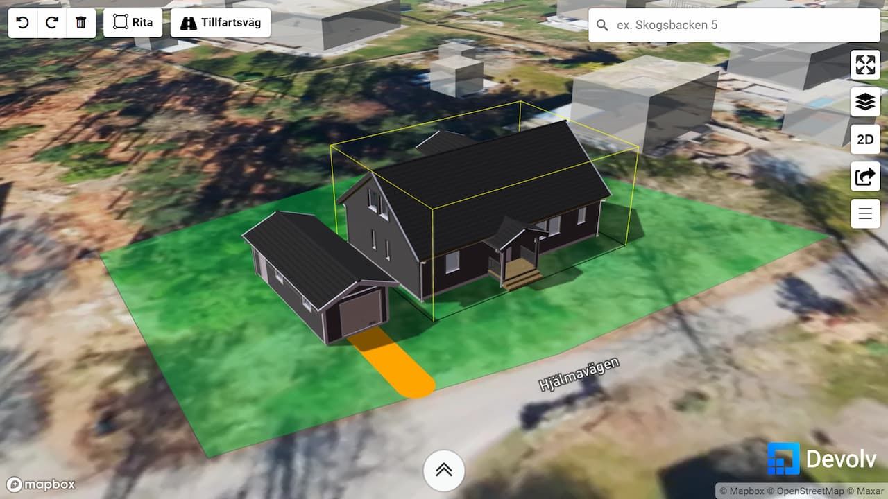 Vyn av en tomt i en interaktiv tomtkarta där ett hus, garage och flera 3D modeller har placerats ut